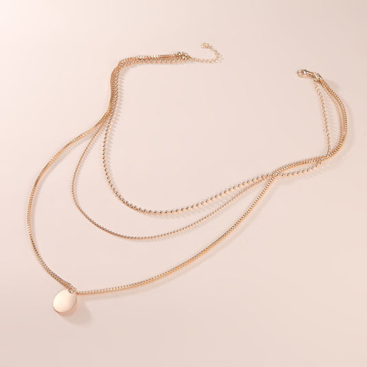 Collar Pendiente Multicapa con Discos Trendy