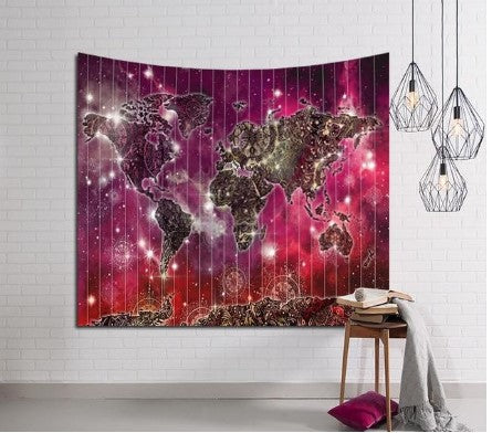 Galaxy world map tapestry in pink and purple, hanging on a white brick wall, with geometric pendant lights.