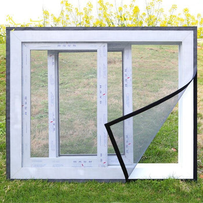White mosquito screen applied to a window, with a hand gently pulling a corner to show its fine mesh texture. - Image 4
