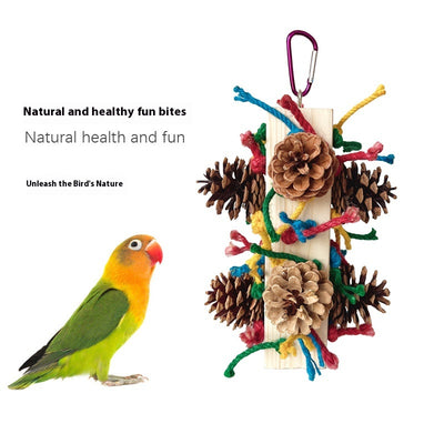 Packaged parrot toy with a wooden block, colorful hemp ropes, and natural pine cones for chewing and play. - Image 2