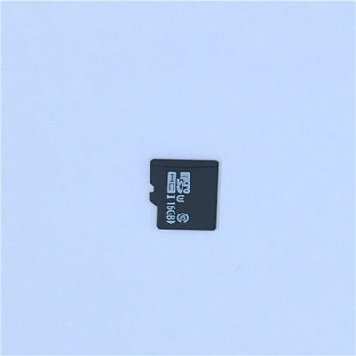 White A9 WIFI wireless network camera with a black lens, shown next to a black 32GB microSD card. - Image 7