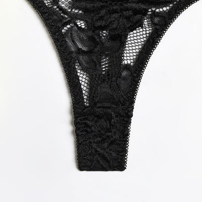 Woman in a neon yellow strappy harness lingerie set over a black lace bra and thong, sitting on a white bed. - Image 8
