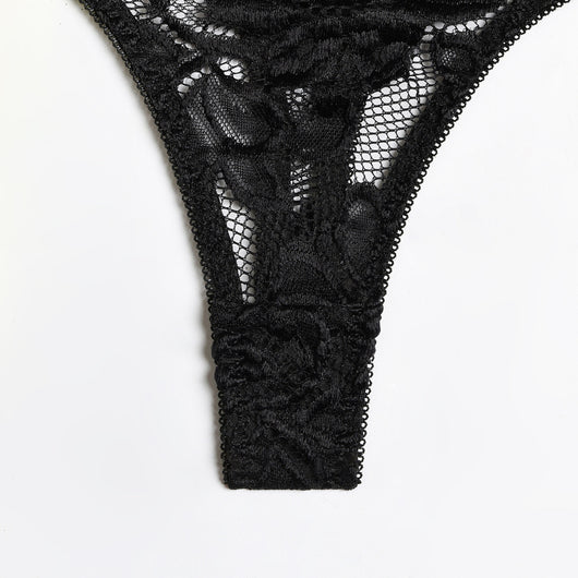 Woman in a neon yellow strappy harness lingerie set over a black lace bra and thong, sitting on a white bed. - Image 8