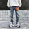 Jeans Rotos con Estampado Graffiti