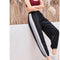 Pantalones deportivos bicolor con textura arrugada para mujer