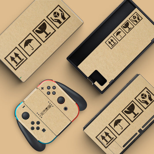 Nintendo Switch console and dock skins with a brown cardboard texture and black shipping symbols for scratch prevention.