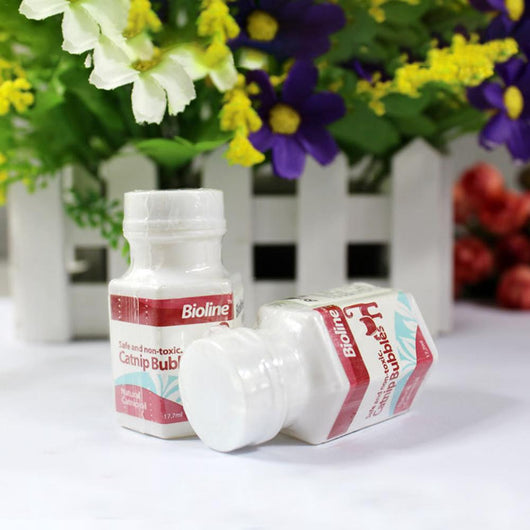Bioline Catnip Bubbles bottle with a red label, featuring a cat silhouette and text "Safe and non-toxic. Natural Catnip oil 17.7ml". A white bubble wand is next - Image 5
