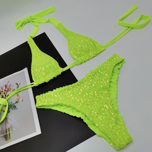 Pink and yellow sequined halter bikini top and high-cut bottoms on a model against a clear blue sky. - Image 7