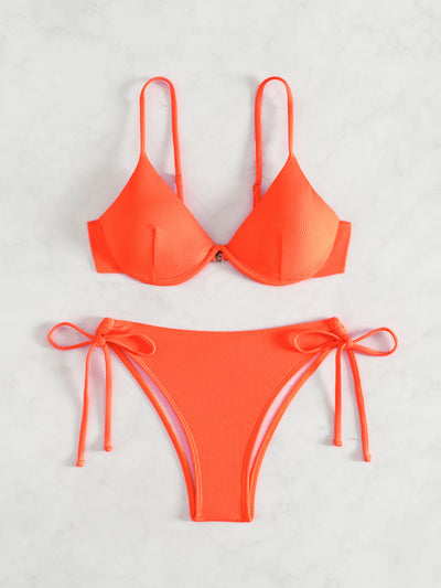 Black ribbed two-piece bikini with an underwire top and tie-side bottoms on a white marble surface. - Image 13