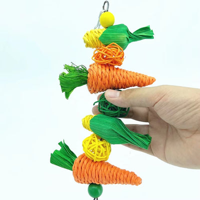 Colorful bird toy with woven straw carrots, corn cobs, braided perches, and a bell, for hanging in a cage. - Image 3