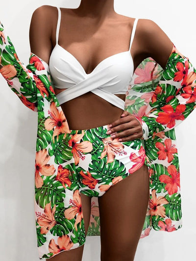 White criss-cross bikini top with high-waisted tropical floral print bottoms and matching long-sleeved cover-up. - Image 3