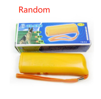 Yellow and black ultrasonic dog training devices with wrist straps, one in retail packaging. - Image 22
