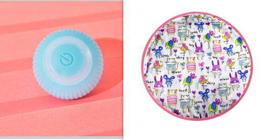 Pink round electronic cat toy with power symbol and a circular cat play mat with cartoon animals and pink border. - Image 13