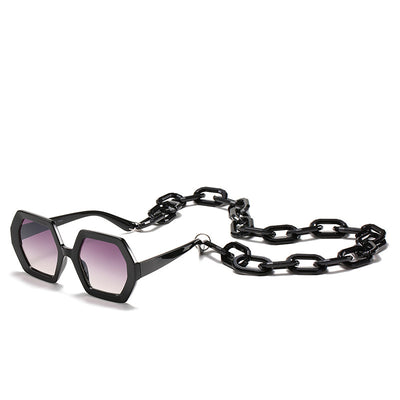 Octagonal sunglasses with brown gradient lenses and a tortoiseshell chain strap on a white background. - Image 4