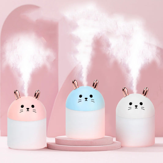 Cute sky blue and white mini USB rabbit humidifier with gold ears, ideal for home or office aromatherapy.