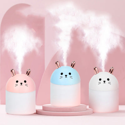 Cute sky blue and white mini USB rabbit humidifier with gold ears, ideal for home or office aromatherapy.