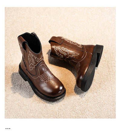 Girls' brown Martin boots with white ethnic embroidery, side zippers, and black soles, displayed on a light carpet. - Image 8