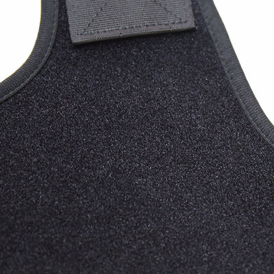 Black back shoulder spine posture corrector worn over a white long-sleeved shirt, showing adjustable straps. (2 pcs) - Image 6