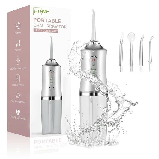 Pink portable electric oral irrigator with clear water tank and four nozzles, highlighting adjustable pressure and pulse mode. - Image 6