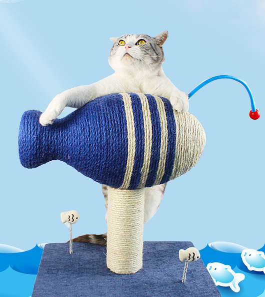 Blue and white striped fish-shaped sisal cat scratching post with a purple base, next to a black and white cat. - Image 8
