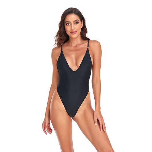 Dark brown one-piece swimsuit with a deep V-neckline and thin adjustable straps, styled with a straw hat and sunglasses. - Image 25