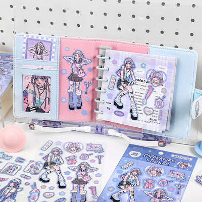 Sheet of self-adhesive stickers featuring an anime angel girl in various poses, hearts, pills, and a winged CD.