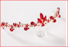 Red rhinestone bridal jewelry set featuring a floral necklace and matching dangle earrings on a model. - Image 9