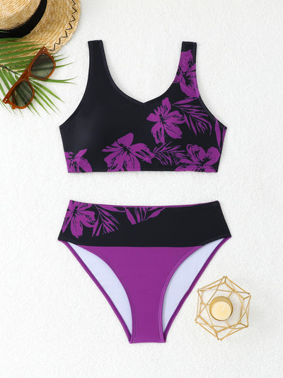 Women's two-piece swimsuit with black and purple floral print. Features a V-neck sports bra top and mid-rise bottom. - Image 36
