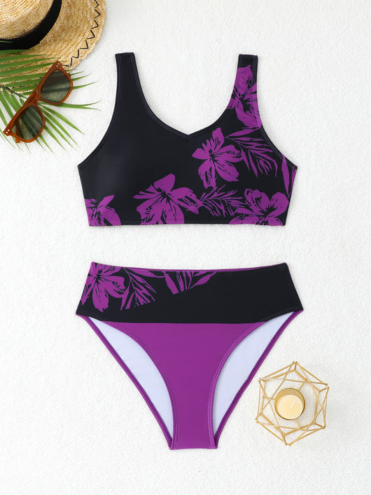 Women's two-piece swimsuit with black and purple floral print. Features a V-neck sports bra top and mid-rise bottom. - Image 36