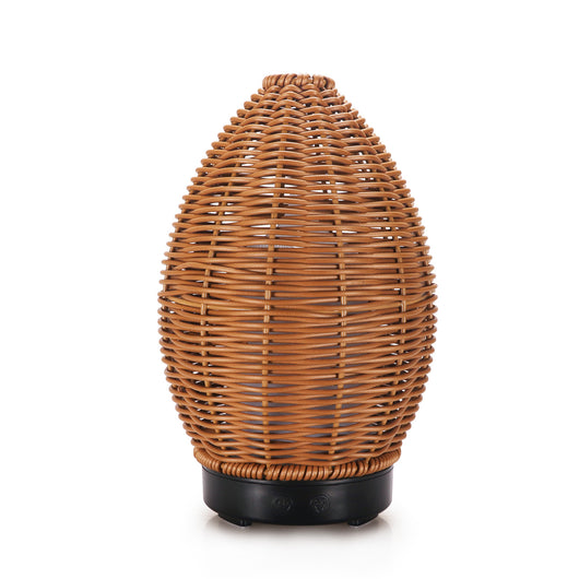 Hollow rattan aroma diffuser with an egg-shaped woven brown exterior and a light wood-grain base. - Image 12