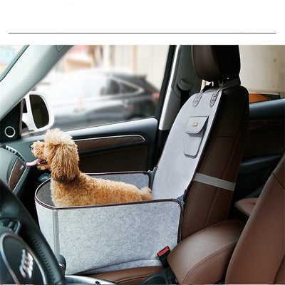 Light grey pet car seat with brown trim on a car's front passenger seat, holding two small dogs. Includes a black pet seatbelt tether. - Image 4
