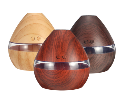 Light wood grain teardrop ultrasonic humidifier and essential oil diffuser with a clear LED light band. - Image 2