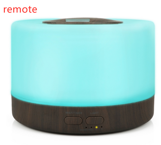 A cylindrical aromatherapy diffuser with a dark wood grain base and a translucent top glowing aqua blue, featuring control buttons. - Image 4