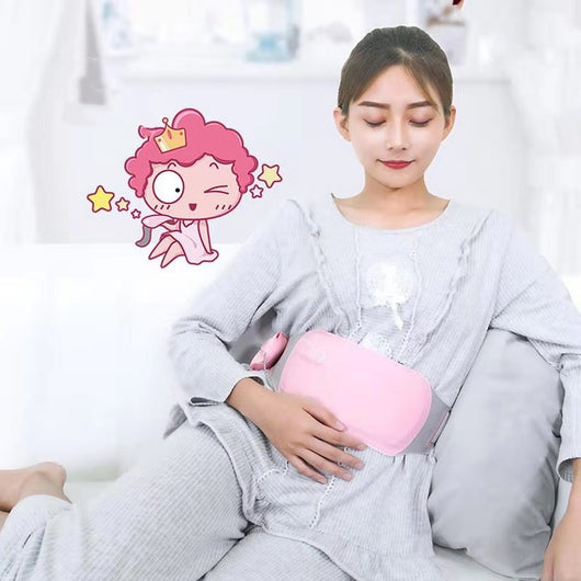 Woman relaxing on a couch, wearing a pink warm palace belt around her lower abdomen for comfort and pain relief. - Image 12