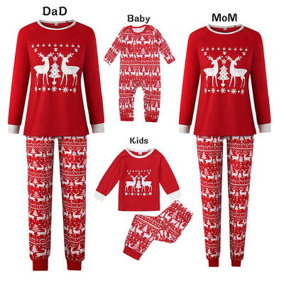 Matching family Christmas pajamas in green with a festive pattern of Santa, reindeer, and Christmas trees. - Image 3