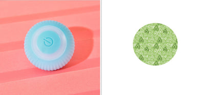 Pink round electronic cat toy with power symbol and a circular cat play mat with cartoon animals and pink border. - Image 11