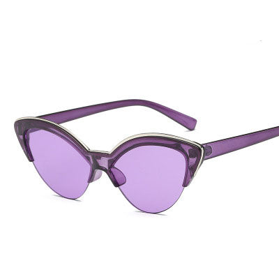Purple cat-eye sunglasses with translucent frames and purple lenses, featuring a silver-tone accent. - Image 12