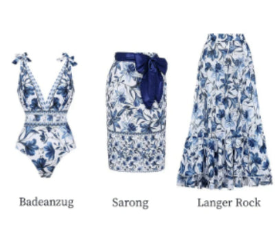 Women's white one-piece swimsuit with deep V-neck, blue floral and geometric patterns, and tie-shoulder straps. - Image 10