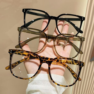 Full-frame trendy blue light blocking glasses with a transparent blue square frame and clear lenses.