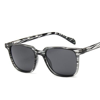 Classic retro midin sunglasses with a black and white striped frame and dark square lenses. - Image 7