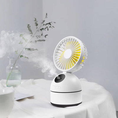 Dark grey fan humidifier with a round fan head and spherical base, emitting mist, on a white desk. - Image 5