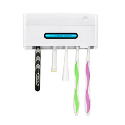 Mint green UV toothbrush sterilizer holder with a 'START' button and a display showing 'UV TOOTHBRUSH STERILIZER'.