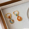 Aretes Dorados Flor Reversible Dos Caras
