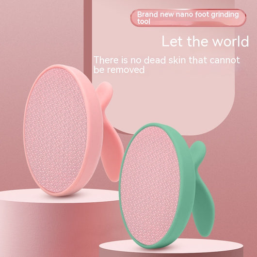 Pink oval nano foot grinder with a textured surface and ergonomic handle, designed for exfoliating and removing calluses.