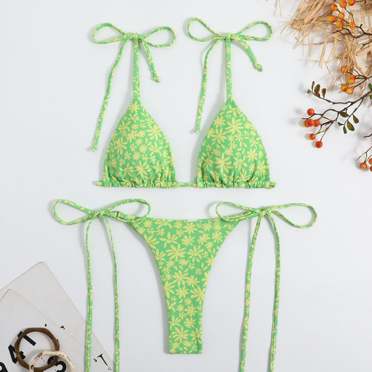 Vibrant floral print bikini set with tie-side triangle top and matching bottoms, featuring pink, blue, orange, and purple flowers. - Image 16