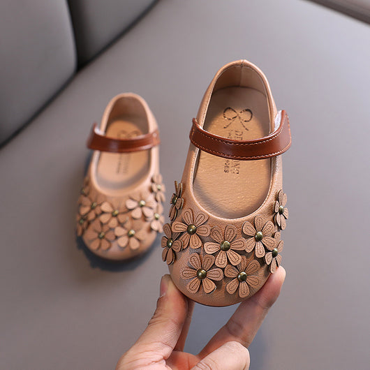 Black Mary Jane shoes for girls with 3D flower appliques on the toe and a brown hook-and-loop strap. - Image 7