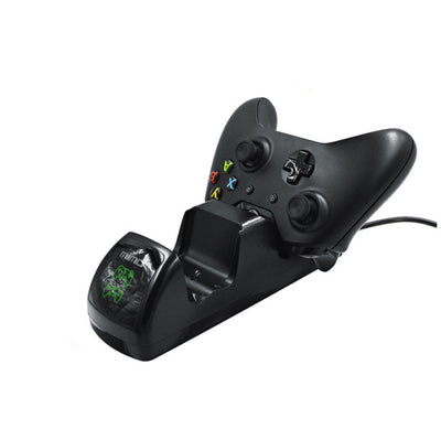 Black dual charging dock for Xbox One wireless controllers with an LED display, shown with two black controllers. - Image 11