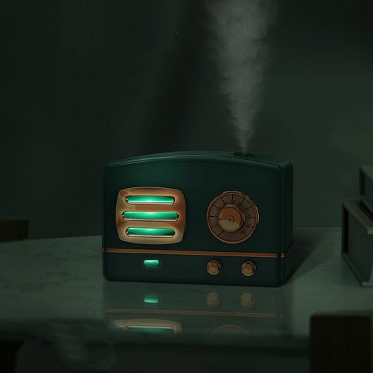 White retro humidifier with rose gold accents, designed like a vintage radio, emitting a fine mist. - Image 3