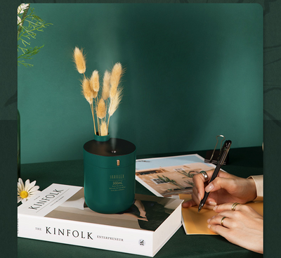 Dark green cylindrical humidifier with a black top, 300mL capacity, and a single control button. - Image 13