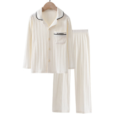 Beige ribbed cotton children's pajama set with long-sleeved lapel top and matching pants, featuring black trim. - Image 11